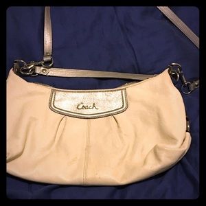 White and sliver coach purse